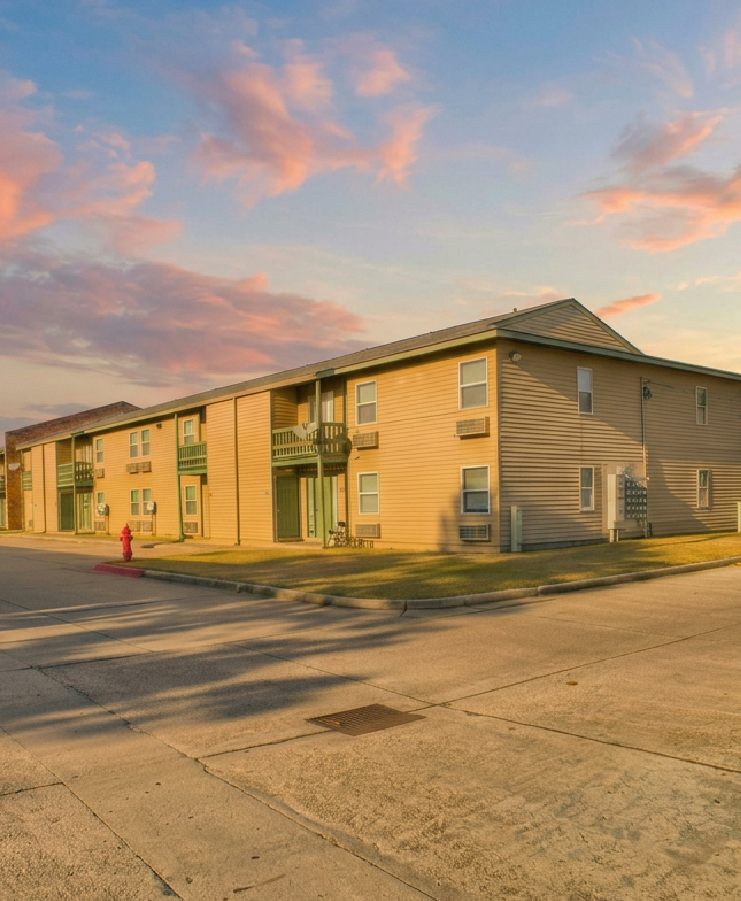 The Ameline apartment community exterior at sunset in New Orleans East